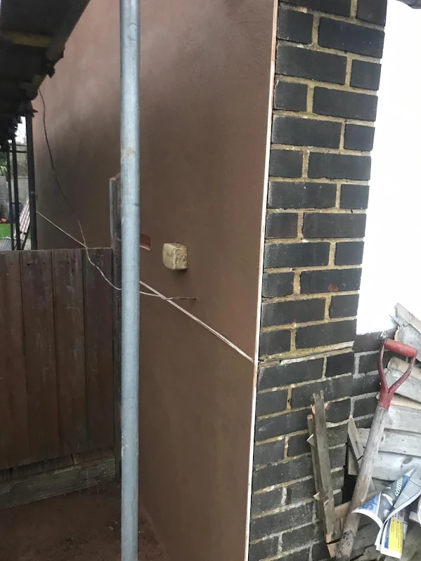A close view of the brown render coat