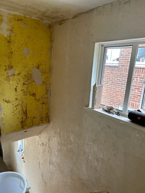 The corner, paint still on one wall